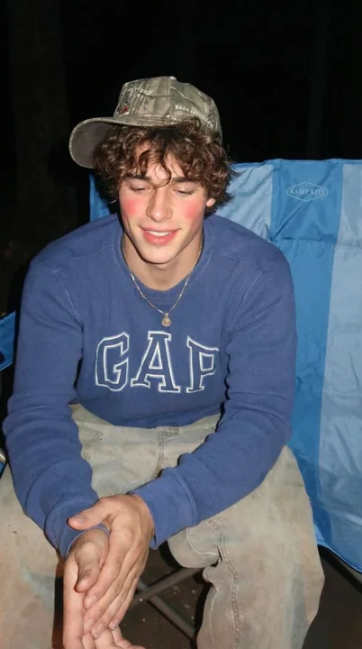 Leisurely Camping Boy in the Sunny Forest