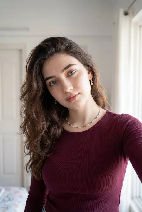 Wine-red knitted girl's warm self-portrait