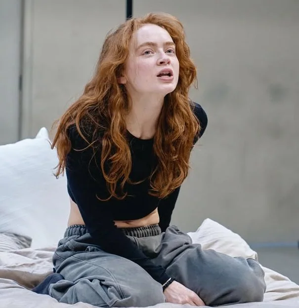 The Quiet Reflection of the Red-Haired Girl