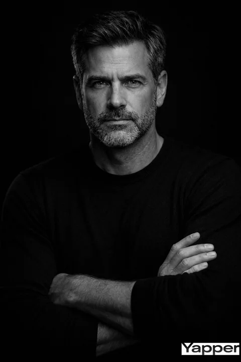 Contemplative Black and White Portrait in Subtle Lighting