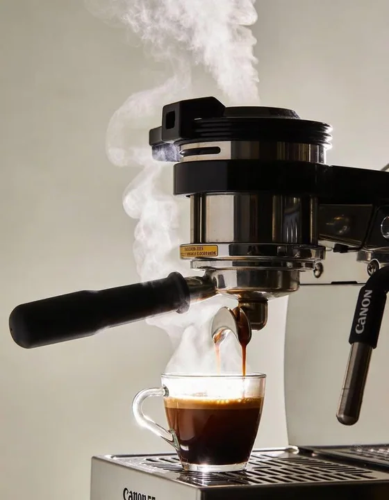 Ultra-realistic commercial photography of an Italian espresso machine extracting espresso