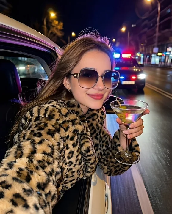 Close-up of a luxurious, fashionable socialite beside a luxury car in the neon night scene